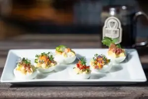 A plate of colorful deviled eggs