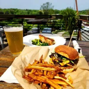 Burger and fries at outdoor restaurant table