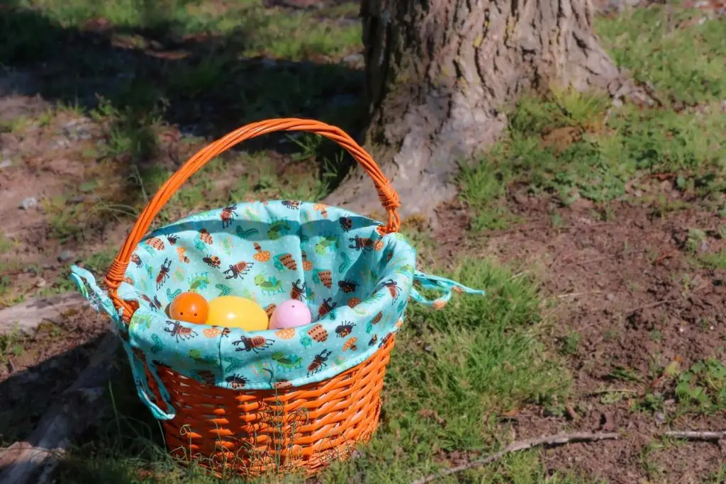 Plastic eggs in woven basket
